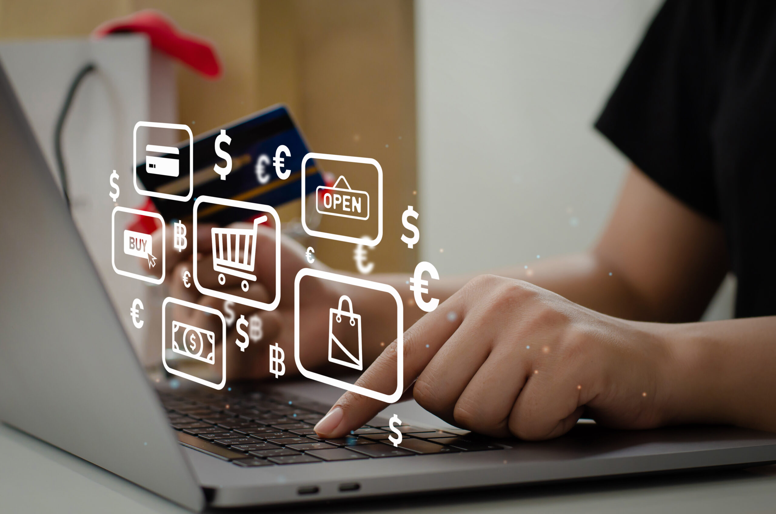 woman holding credit card using computer to shop online at home mujer comparndo en linea